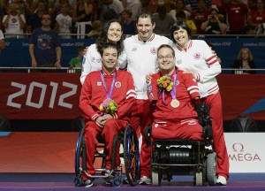LONDON, ENGLAND 09/04/2012 Marco Dispaltro and Josh Vander Vies with (Coach) Cesar Nicolai, (Assistant) Karin Sterkenburg and (Assistant) Dalia Mykolaitiene receiving the Bronze Medal in the Boccia Mixed Pairs - BC4 at the London 2012 Paralympic Games at Excel. (Photo by Matthew Murnaghan/Canadian Paralympic Committee)